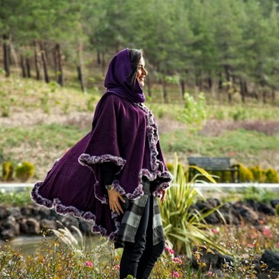Source photo — woman in a purple hooded cloak